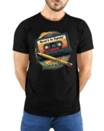 Retro Rewind To The Beginning Cassette Tape Graphic T Shirt - model wearing black tee with hands behind back