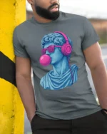 Cool David Statue With Headphones Bubblegum Pop Art T Shirt - model wearing grey tee, leaning on column