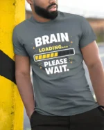 Brain Loading Please Wait Funny Sarcastic Humor Graphic T Shirt - model wearing grey tee, leaning on column