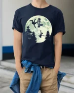 Funny Moonlight BMX Alien Parody Graphic T Shirt Retro Bike Tee - model wearing navy tee with hands in pockets