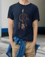 Native Dreamcatcher Arrow Symbol Spiritual Graphic T Shirt - model wearing navy tee with hands in pockets