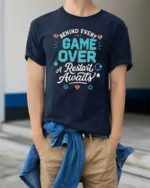 Behind Every Game Over A Restart Awaits Retro Gamer Graphic T Shirt - model wearing navy tee with hands in pockets