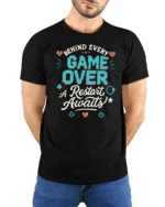 Behind Every Game Over A Restart Awaits Retro Gamer Graphic T Shirt - model wearing black tee with hands behind back