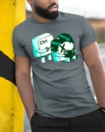 Funny Ctrl X Excel Spreadsheet Office Humor Graphic T Shirt - model wearing grey tee, leaning on column