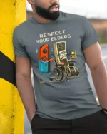 Respect Your Elders Retro Gaming Humor Graphic T Shirt Gamer Tee - model wearing grey tee, leaning on column
