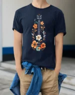 Floral Guitar Music Lover Vintage Folk Art Graphic T Shirt - model wearing navy tee with hands in pockets