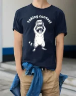 Taking Control Funny Raccoon Keyboard Ctrl Tech Humor T Shirt - model wearing navy tee with hands in pockets