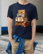 Vintage Travel Suitcase Stack Adventure Wanderlust Graphic T Shirt - model wearing navy tee with hands in pockets