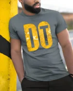 Just Do It Inspired Motivational Bold Typography Graphic T Shirt - model wearing grey tee, leaning on column