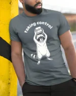 Taking Control Funny Raccoon Keyboard Ctrl Tech Humor T Shirt - model wearing grey tee, leaning on column