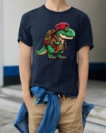 Cute Backpack Dinosaur T Shirt Funny T Rex Adventure Cartoon Graphic - model wearing navy tee with hands in pockets