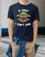 A Shit I Dont Give Funny Meditating Baby Alien Meme T Shirt - model wearing navy tee with hands in pockets