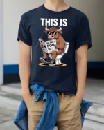 This Is Bull Reading The Daily Poo Funny Toilet Humor T Shirt - model wearing navy tee with hands in pockets