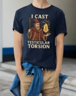 Funny I Cast Testicular Torsion T Shirt Wizard Dark Humor Meme Graphic - model wearing navy tee with hands in pockets