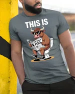 This Is Bull Reading The Daily Poo Funny Toilet Humor T Shirt - model wearing grey tee, leaning on column
