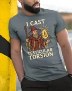 Funny I Cast Testicular Torsion T Shirt Wizard Dark Humor Meme Graphic - model wearing grey tee, leaning on column