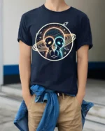Cosmic Alien Encounter Graphic T Shirt Galactic Space Art - model wearing navy tee with hands in pockets