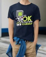 Funny Retro Gamer Its OK To Play With Yourself T Shirt - model wearing navy tee with hands in pockets