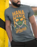 Funny Crocodile Hana Hana Hawaii Vacation Graphic T Shirt - model wearing grey tee, leaning on column