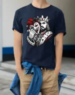 King Holding Joker Mask Dark Royal Graphic T Shirt Style - model wearing navy tee with hands in pockets