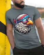 Patriotic Bald Eagle Sunglasses American Flag Graphic T Shirt - model wearing grey tee, leaning on column