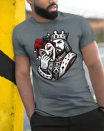 King Holding Joker Mask Dark Royal Graphic T Shirt Style - model wearing grey tee, leaning on column