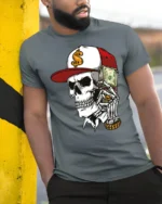 Street Rich Skull With Cash Stack Graphic T Shirt Urban Style - model wearing grey tee, leaning on column