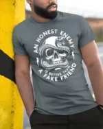Skull And Snake An Honest Enemy Quote Graphic T Shirt - model wearing grey tee, leaning on column
