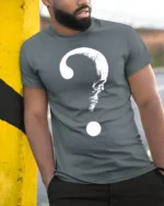 Mysterious Skull Question Mark Dark Humor Graphic T Shirt - model wearing grey tee, leaning on column