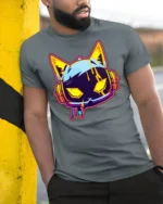 Neon Cyberpunk Gaming Cat Headphones Graphic T Shirt - model wearing grey tee, leaning on column