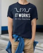 Funny It Works On My Machine Programmer Humor T Shirt - model wearing navy tee with hands in pockets