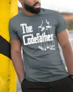 Funny The Codefather Programmer Humor Coding Graphic T Shirt - model wearing grey tee, leaning on column