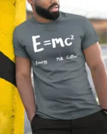 Funny E mc2 Energy Milk Coffee Science Humor T Shirt - model wearing grey tee, leaning on column