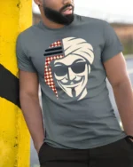 Arabian Anonymous Mask Graphic T Shirt Bold Desert Rebel Tee - model wearing grey tee, leaning on column