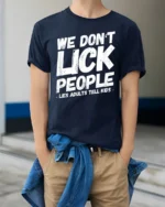 We Dont Lick People Funny Sarcastic Humor Quote T Shirt - model wearing navy tee with hands in pockets