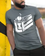 Product - model wearing grey tee, leaning on column