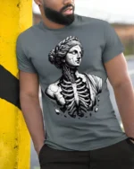 Gothic Broken Greek Statue Skeleton Dark Art Graphic T Shirt - model wearing grey tee, leaning on column