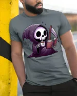 Cute Grim Reaper Reading Book And Drinking Coffee T Shirt - model wearing grey tee, leaning on column