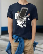 Funny Phone Sitting On Toilet Social Media Addict Graphic T Shirt - model wearing navy tee with hands in pockets