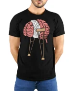 Funny Broken Brain On Crutches Graphic T Shirt Mental Humor Tee - model wearing black tee with hands behind back