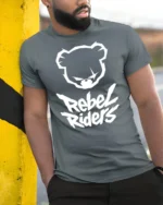 Rebel Riders Bear Graphic T Shirt Streetwear Bold Urban Style Tee - model wearing grey tee, leaning on column