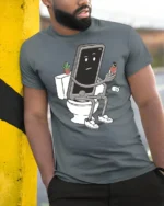 Funny Phone Sitting On Toilet Social Media Addict Graphic T Shirt - model wearing grey tee, leaning on column