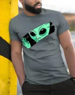 Funny Alien Peeking Graphic T Shirt Cute UFO Cartoon Tee - model wearing grey tee, leaning on column