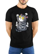Silly Climbing Cat Wide Eyes Cute Cartoon Graphic Tee Shirt - model wearing black tee with hands behind back