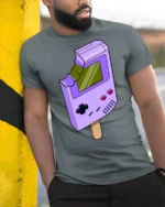Retro Game Console Ice Cream Funny Gamer Graphic T Shirt - model wearing grey tee, leaning on column