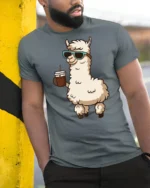 Cute Llama Drinking Coffee Cool Style Cartoon Graphic Tee Shirt - model wearing grey tee, leaning on column
