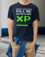 What Doesnt Kill Me Gives Me XP Funny Gamer Graphic T Shirt Retro Style - model wearing navy tee with hands in pockets