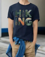 Hiking Nature Landscape Graphic T Shirt Mountain Forest Adventure Style - model wearing navy tee with hands in pockets