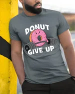 Donut Give Up Funny Gym Graphic T Shirt Cute Workout Motivation Tee - model wearing grey tee, leaning on column