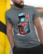 Retro Arcade Machine Graphic T Shirt Vintage Gamer Classic Style Tee - model wearing grey tee, leaning on column